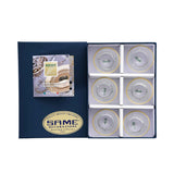 A set of six crystal water glasses with ornate gold bands displayed in a premium navy blue SAME Decorazione gift box.