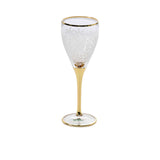 A single elegant wine glass featuring a frosted white leaf pattern on the bowl and a solid 24k gold-finished stem and base.