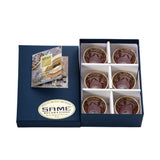 An angled view of the luxury presentation box showing the secure fit and the SAME Decorazione gold seal of quality.