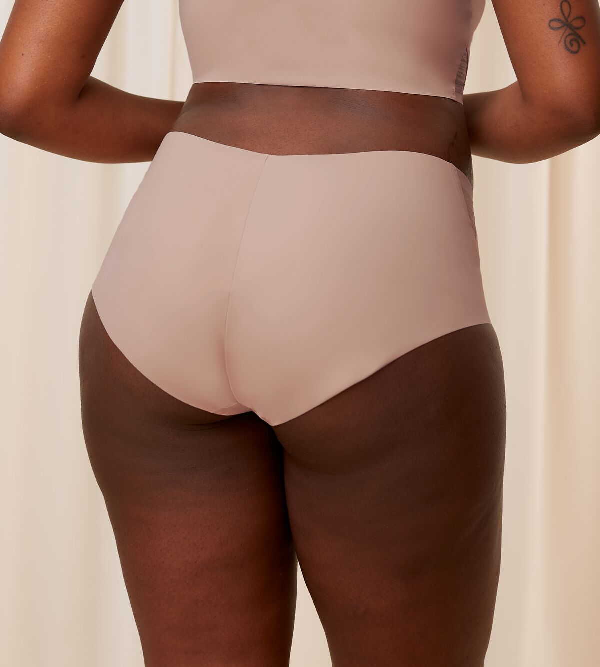 Second Model back view of the Triumph Flex Smart beige maxi panty, showing the high-waisted design and smooth, neutral stretch fabric. Available for Online Purchase