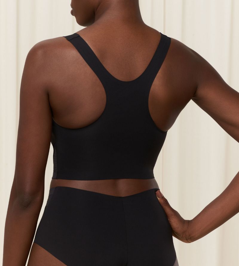 Second Model back view of the Triumph Flex Smart black pull-on bra top, highlighting the smooth neckline and flexible, wire-free design. Order Online Today