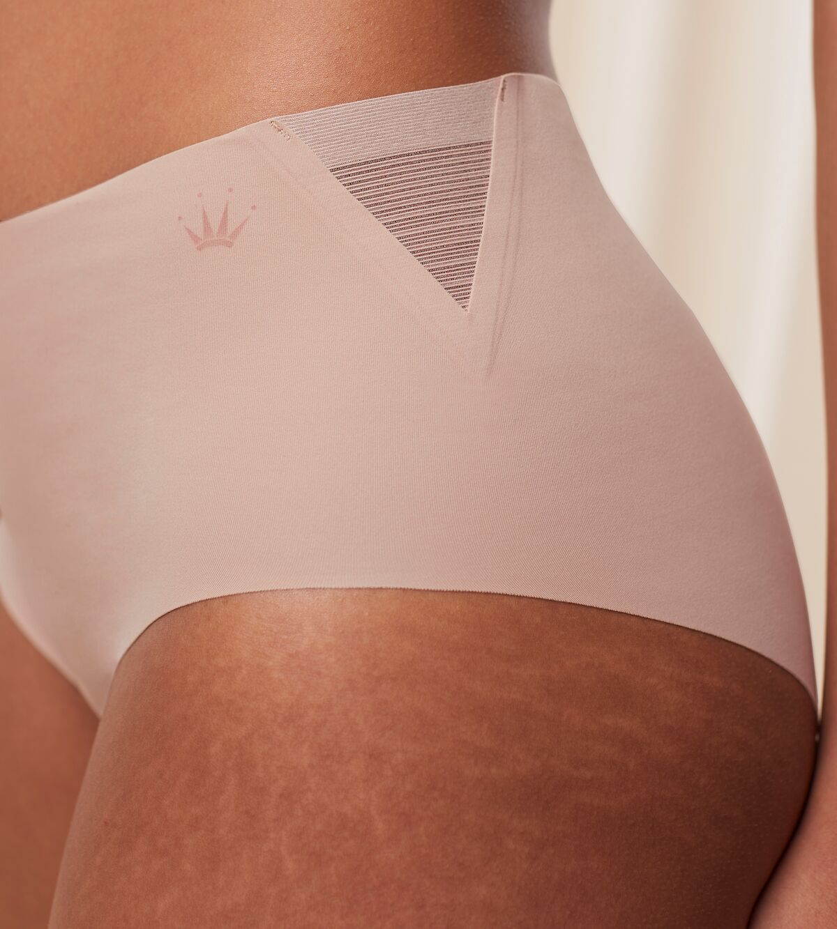 Second Model close-up side view of the Triumph Flex Smart beige maxi panty, showing the high-waisted design and smooth, neutral stretch fabric. Available for Online Purchase