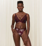 Second Model full front view of the Triumph Lavish Spotlight burgundy high waist thong, showcasing the intricate lace embroidery and sheer mesh details. Now Available Online