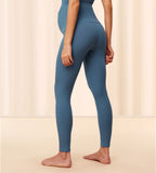 Second Model side view of the Triumph Natural Spotlight blue rib comfort stretch trousers, highlighting the pregnancy-friendly waistband and wide-leg cut. Shop Online