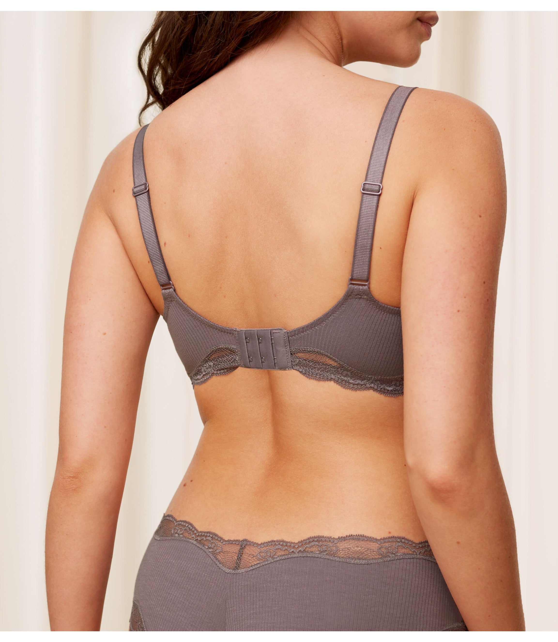 Second model back view of the Triumph Natural Spotlight grey maternity bra, showing the adjustable straps and back closure. Available Online Now
