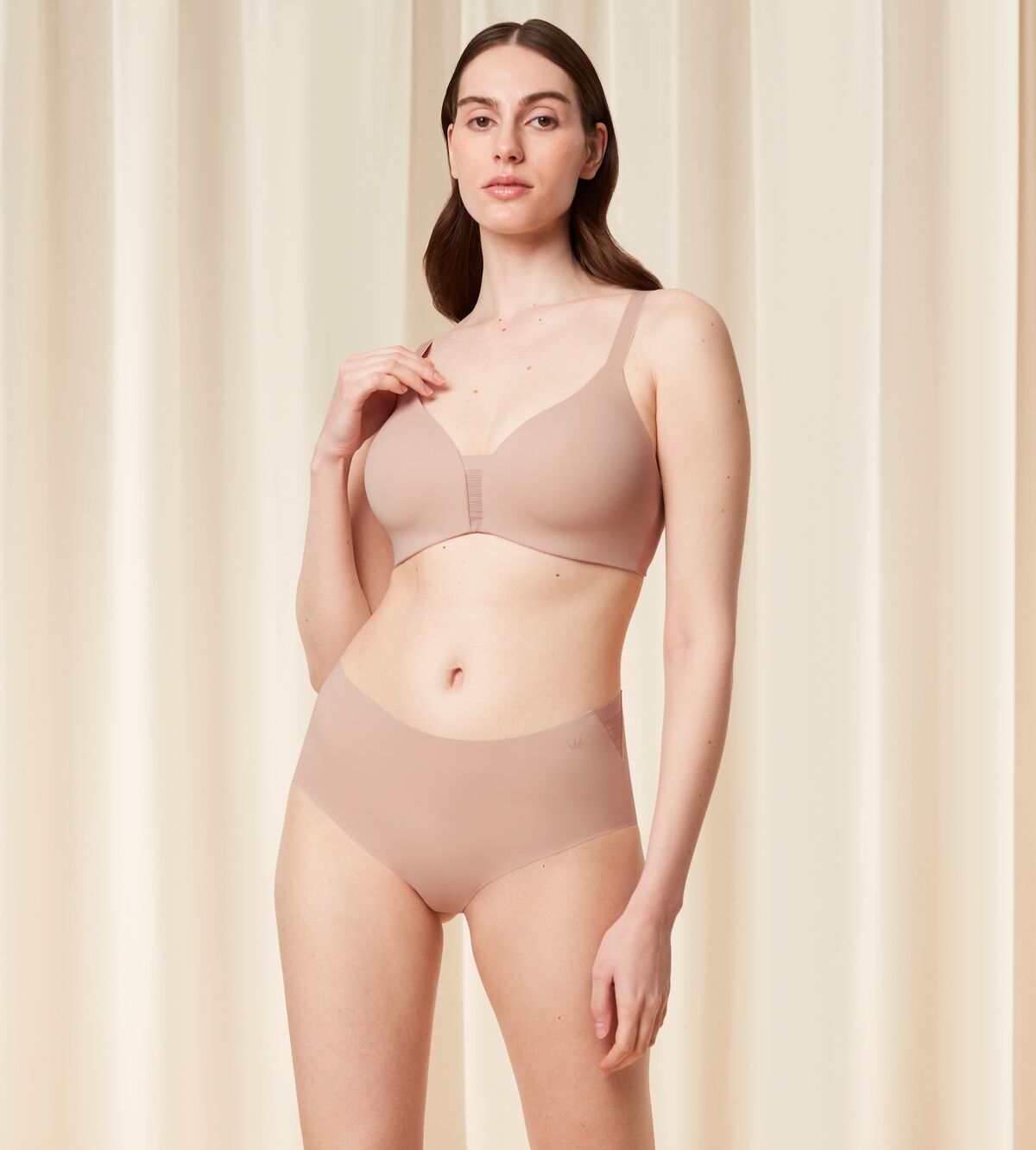 Second model full front view of the Triumph Fit Smart beige non-wired bra, highlighting the stretchable lace design and wireless comfort construction. Available Online Now