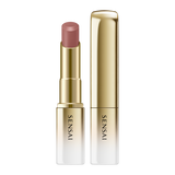 Sensai lipstick with gold casing on a white background.