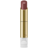 Lipstick with gold casing and white base on a white background.