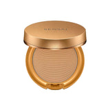 A luxury cosmetic jar of Sensai Translucent Loose Powder. The design features a deep purple translucent base and a high-shine bronze-gold lid with a subtle concentric circle pattern. The matching purple retail box is visible in the background with "SENSAI" printed in elegant white lettering.