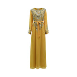 Front view of a SHAIRA mango-colored maxi dress featuring heavy gold and silver floral beadwork on the chest, a belted waist, and long sleeves on a white background.