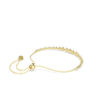 A side perspective view of the Swarovski Imber bracelet, highlighting the smooth, high-shine gold-plated bezel backings and the adjustable sliding ball mechanism.