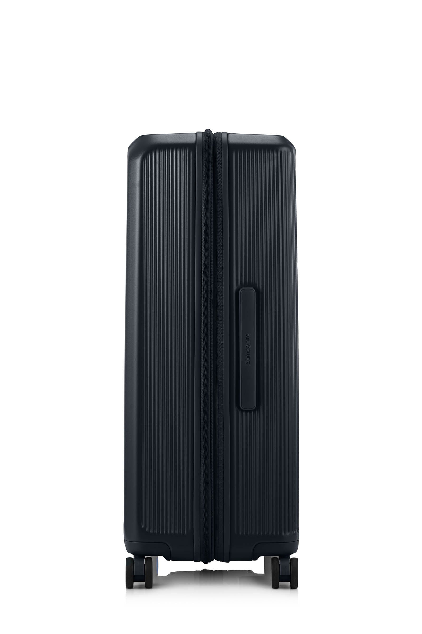 Side view of the Samsonite Voypod Spinner large in Black, showcasing its sleek, boxy hardshell design and the prominent front-access pocket panel. Shop Online Today