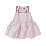 Front view of a Simonetta pale pink satin sleeveless dress for girls featuring a square neckline and burgundy scalloped rickrack trim.