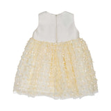 Back view of the Simonetta bow-covered dress showing the smooth satin back and the concealed zipper closure.