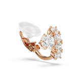 A close-up view of a single Swarovski Matrix clip earring with the rose gold-plated hinge clasp in the open position, showing the cushion pad and the claw-set crystal details.