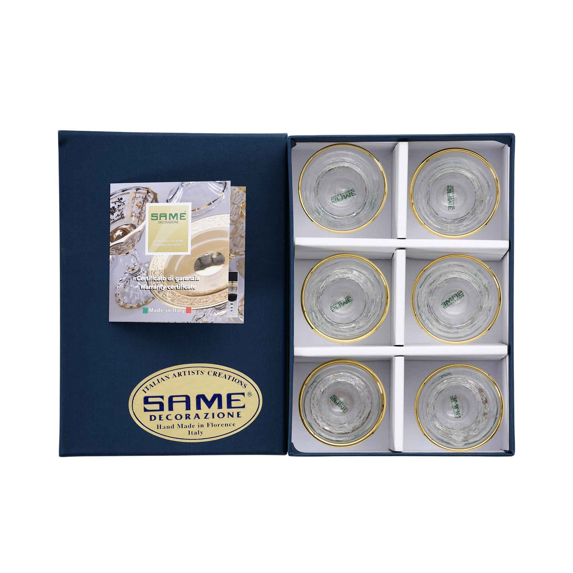 Six silver-speckled crystal cups arranged in a luxury navy blue presentation box with a warranty certificate