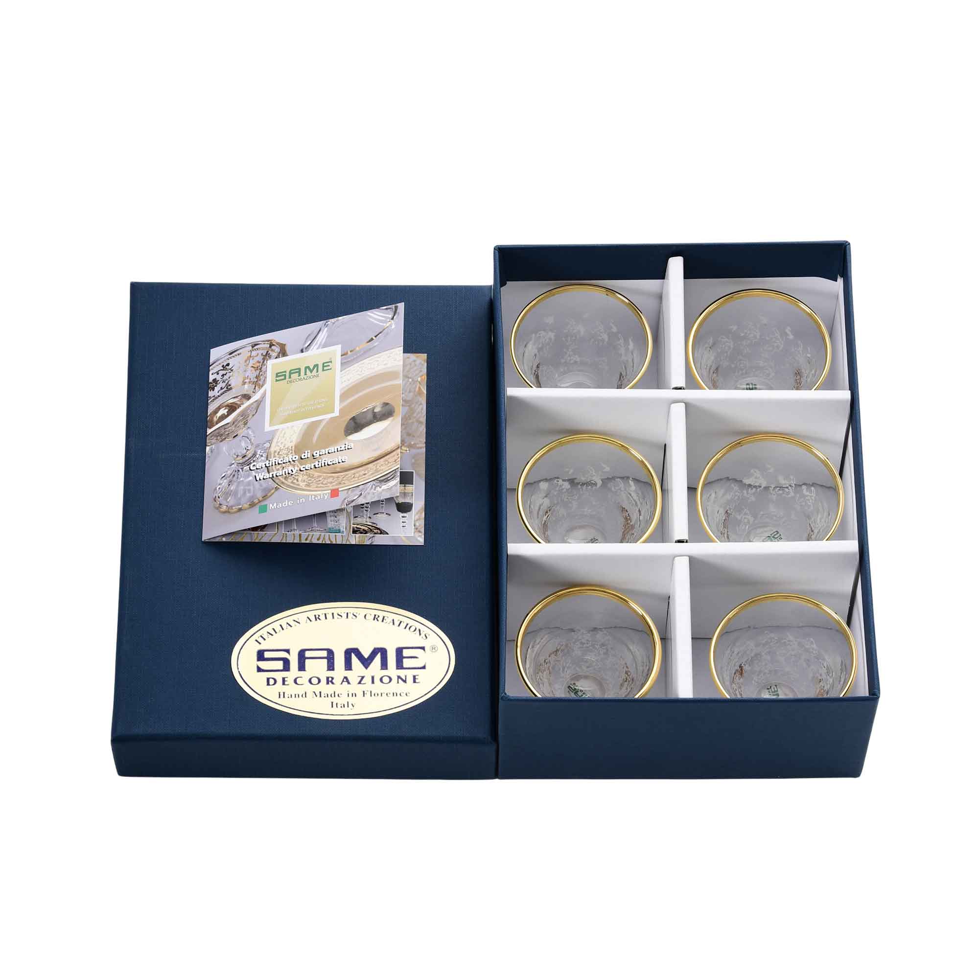 Top-down view of six SAME Decorazione cups in their protective gift packaging, highlighting the brilliant gold-trimmed borders