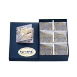 Top-down view of six SAME Decorazione cups in their protective gift packaging, highlighting the brilliant gold-trimmed borders