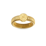 A slightly high-angle studio view of the yellow gold-plated statement ring, displaying the uniform ribbed texture of the inner and outer band structure.