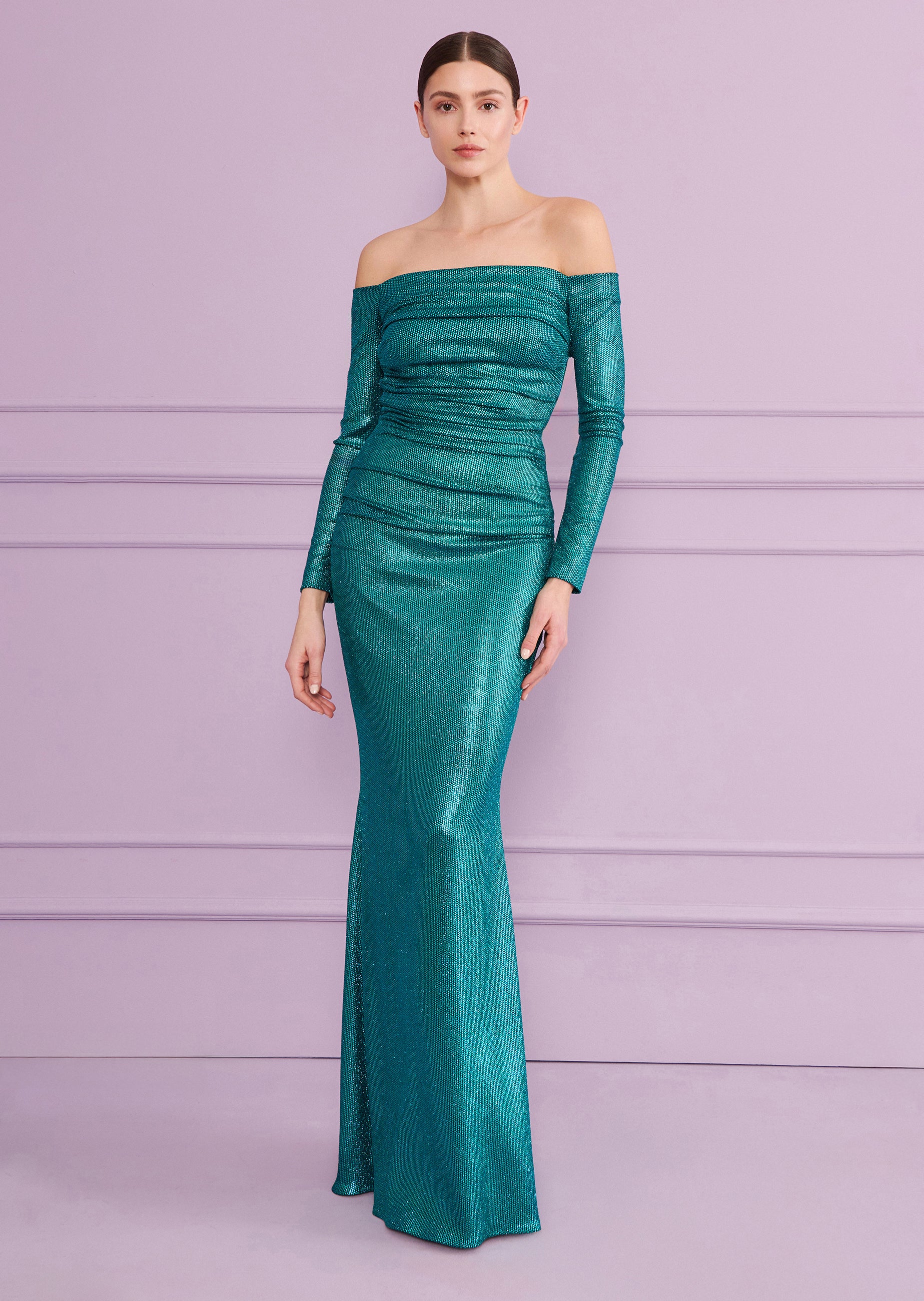 Shimmering teal off-the-shoulder long dress with a ruched bodice, long sleeves, and a floor-length fitted skirt.