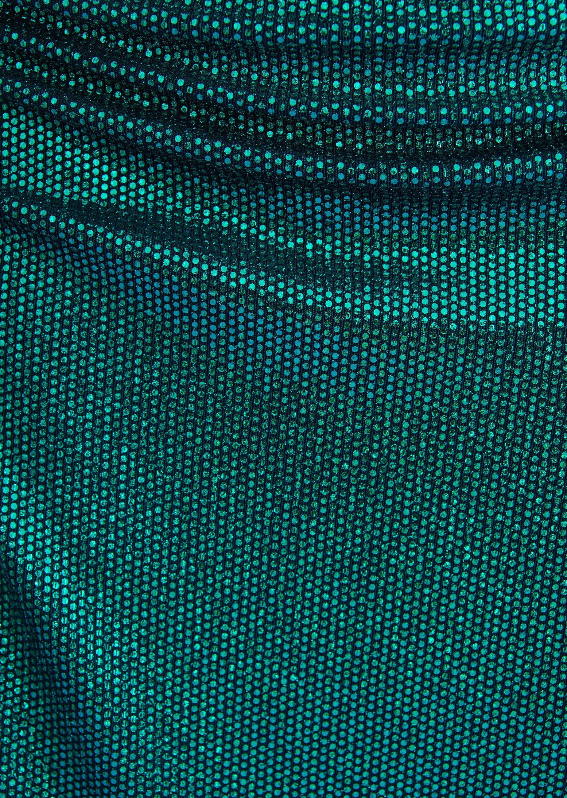 Iridescent teal sequined fabric with small, tightly packed sequins, showing gentle folds.