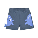 Front view of the Stella McCartney Kids slate blue toddler jersey shorts featuring elastic waistband, faux drawstring, and playful blue whale side appliques with 3D fins.