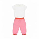 Back full view of a Stella McCartney Kids baby girls outfit showing the plain white back of the short-sleeved t-shirt and the pink back of the trousers featuring two rear patch pockets and a contrasting orange elasticated waistband.