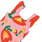 Detailed close-up shot of the shoulder strap on a Stella McCartney Kids pink swimsuit, showcasing the vibrant red ruffle trim and the colorful abstract tulip print.