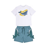 Front flat-lay view of a Stella McCartney Kids two-piece set featuring a white "Sea You Around" whale graphic t-shirt and matching teal shorts with 3D side fins.