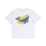 Front close-up of a white Stella McCartney Kids organic cotton toddler t-shirt with a blue cartoon whale graphic and yellow text reading "Sea You Around."