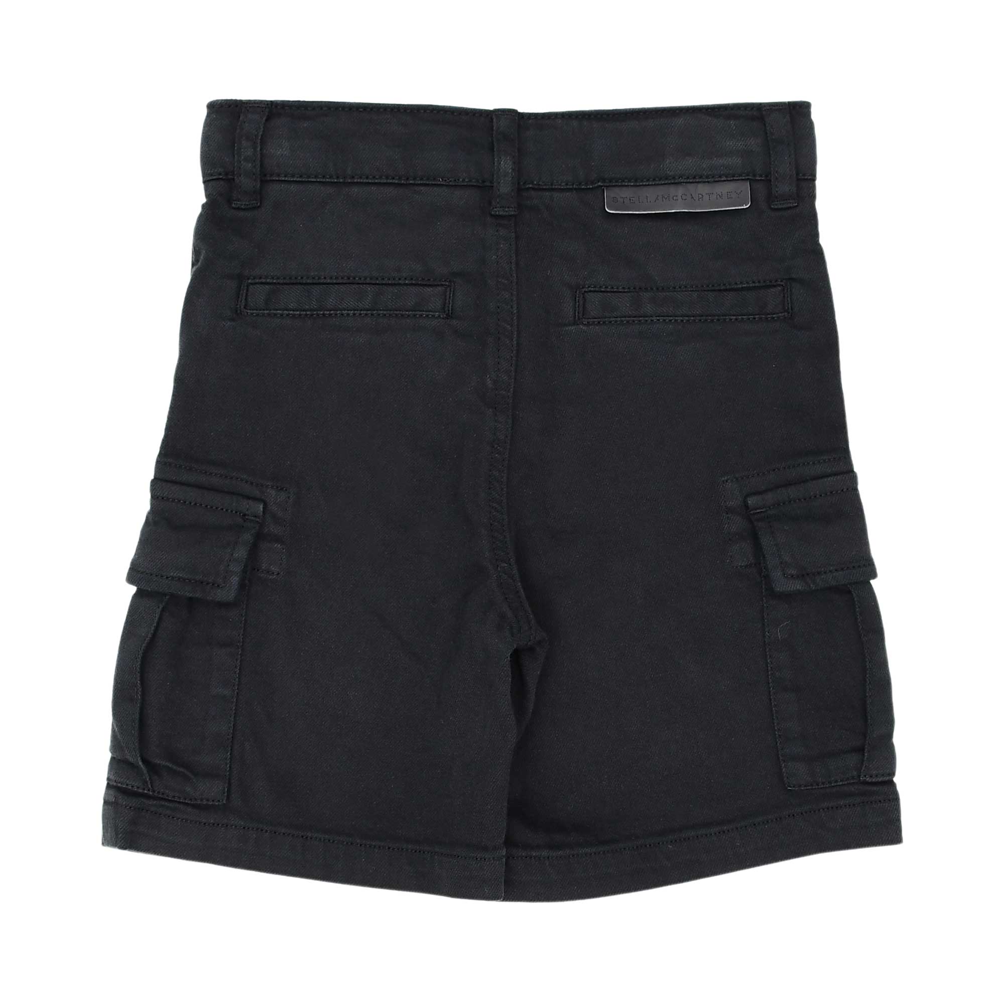 Back view of children's black twill shorts showing the rear welt pockets and a signature logo tab on the waistband.