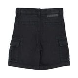 Back view of children's black twill shorts showing the rear welt pockets and a signature logo tab on the waistband.