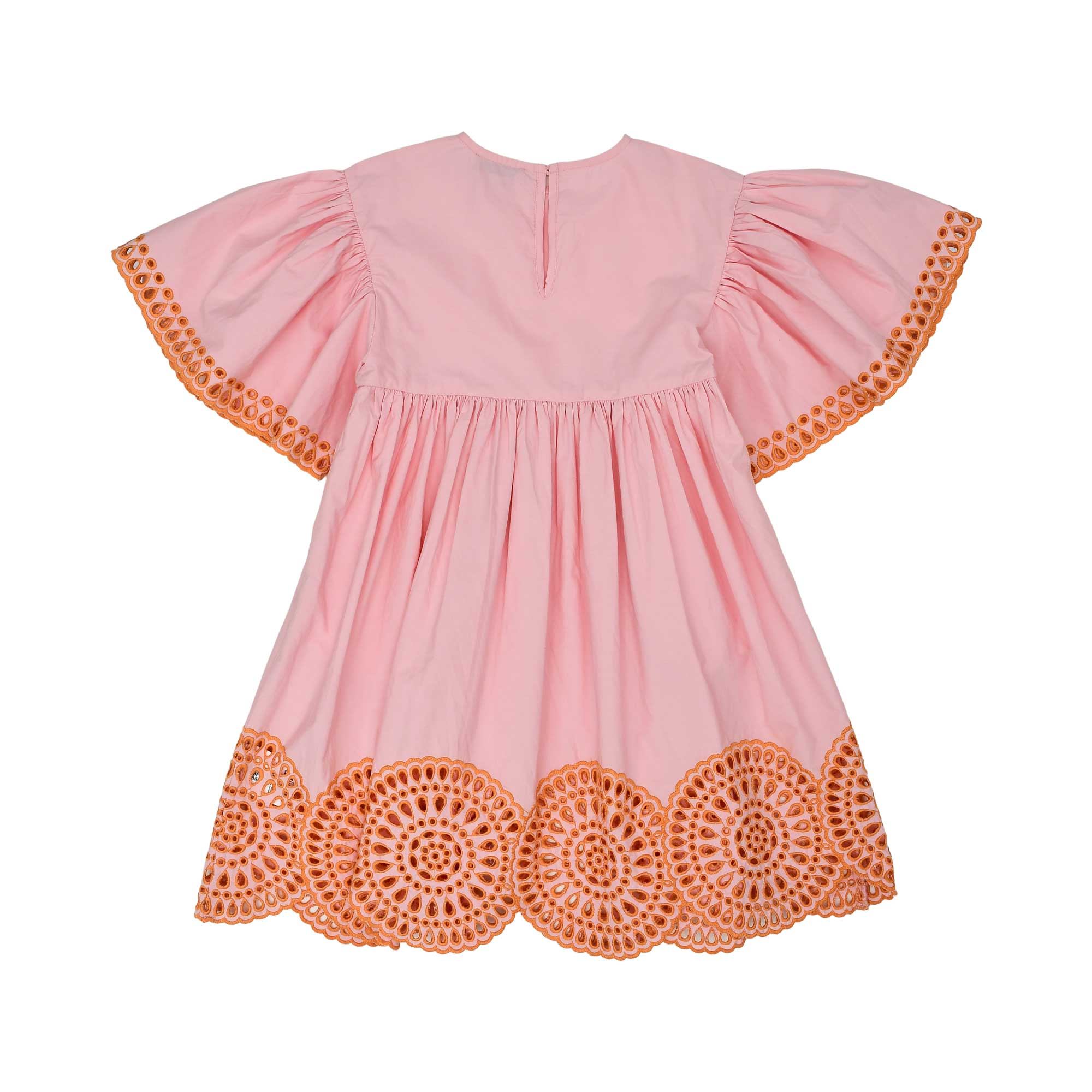 Back view of a pink children's dress showing the keyhole button closure and large orange medallion embroidery on the sleeves and skirt.