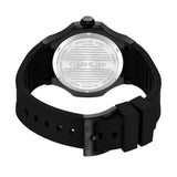 Focused view of the matte black ion-plated stainless steel tang pin buckle on the grooved black rubber strap, featuring the etched brand signature.