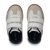 Pair of low-cut sneakers with beige toes, white fronts, and two white velcro straps. Features navy blue lining and brown outs