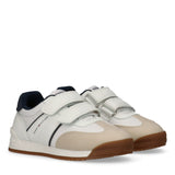 Pair of Tommy Hilfiger Kids low-cut sneakers in beige, white, and blue with two white Velcro straps and a brown rubber sole.