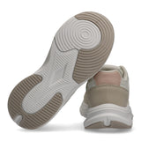 Off-white and nude low-cut sneaker with a chunky off-white midsole and a two-tone textured outsole. The heel has a light pink