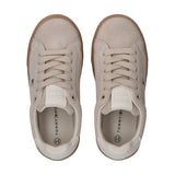 Pair of beige/off-white suede low-cut lace-up sneakers with gum soles, small flag logo on side, and off-white heel trim.
