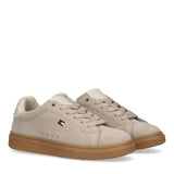Pair of beige and off-white Tommy Hilfiger Kids low-cut lace-up sneakers with a brown sole.