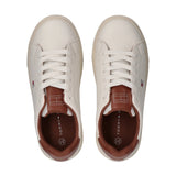 Pair of off-white low-cut lace-up sneakers with brown tongues, collar lining, and small flag logo on the side.
