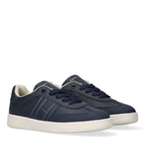 Pair of navy blue Tommy Hilfiger Kids low-cut lace-up sneakers with off-white soles and side stripe details.