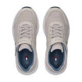 Beige mesh low-cut sneakers with white soles, beige laces, and velcro straps. Blue lining and insoles feature a flag logo.