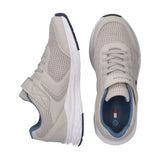 Kids low-cut beige mesh sneakers with synthetic overlays, white sole, blue trim, lace-up front, and a Velcro strap with flag