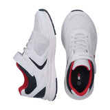 White mesh and synthetic low-cut sneakers with laces, velcro strap, navy blue accents, and red lining.