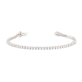 Silver-toned tennis bracelet with a continuous line of clear, brilliant-cut stones and a box clasp.