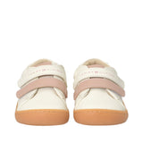 Off-white mid-cut sneakers with pink velcro straps, 'TOMMY HILFIGER' text on straps, and tan rubber soles.