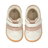 Off-white mid-cut sneakers with pink accents. Two velcro straps per shoe: an off-white strap with "TOMMY HILFIGER" and a pink