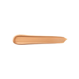 A long, smooth swatch of bisque-colored concealer with a creamy texture.
