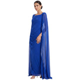 Royal blue long draped dress with a square neckline and integrated sheer cape sleeves, extending to the floor.