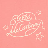 Pink knit t-shirt with white rope-style 'Stella McCartney' text and three white outline stars.